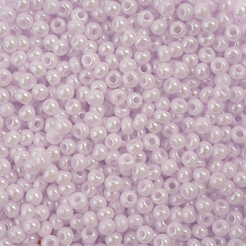Czech Seed Beads 11/0 Opaque Natural Pink Luster: Crystal glass round beads in a close-up pile.