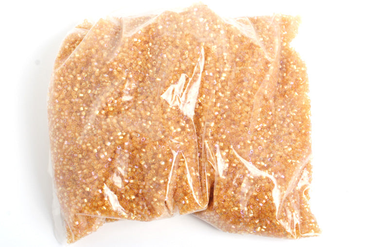 Czech Seed Beads 10/0 2-cut Transparent Aurora Borealis Strung